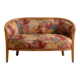 Two-seater banquette in Louis XV style made of wood and floral fabric.