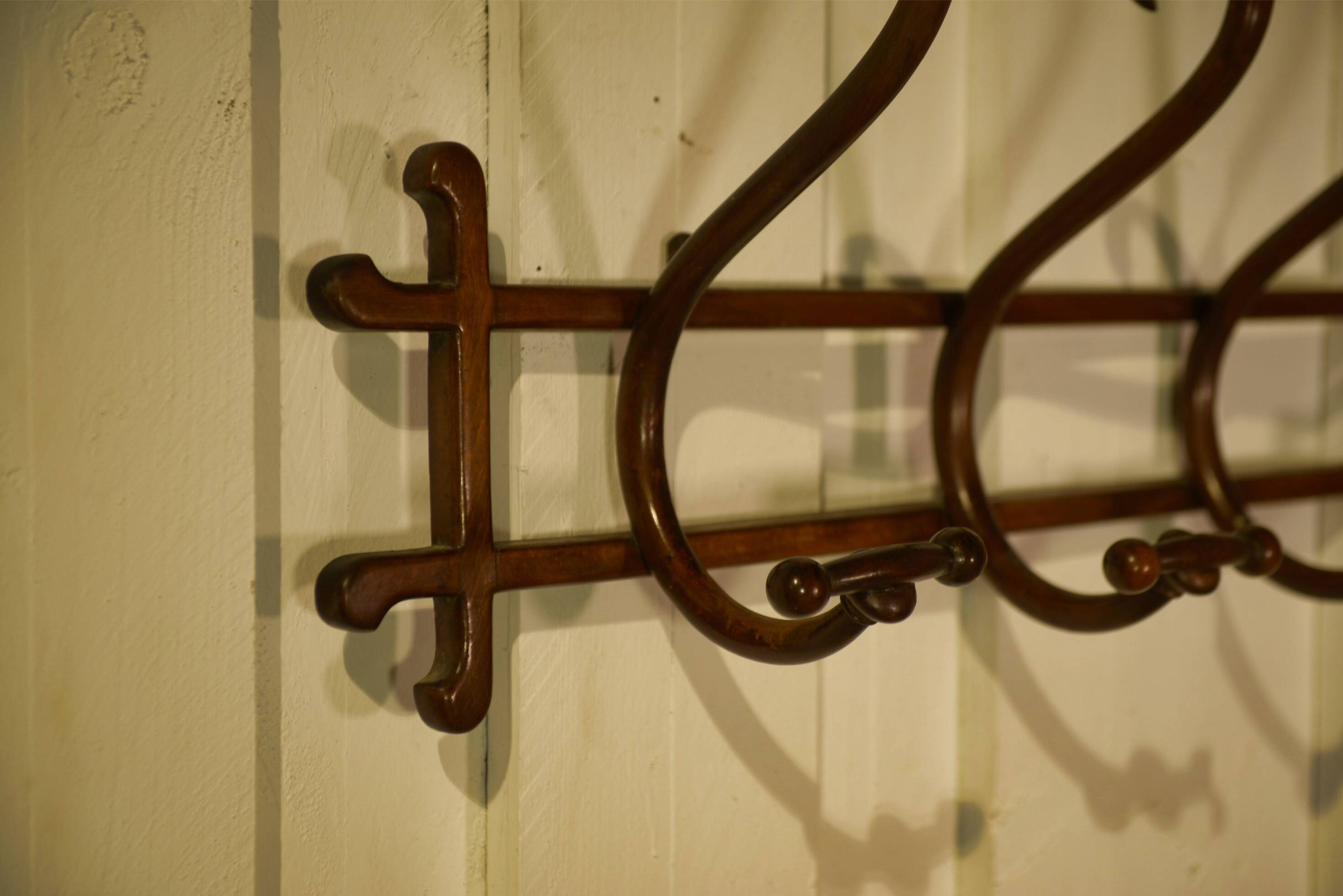 Curved beech wall coat rack published by Thonet, 1930s.
