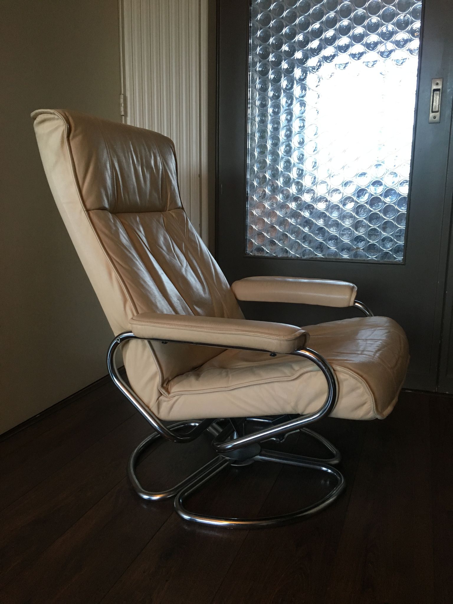 Mid-century danish leather & tubular steel swivel lounge armchair
