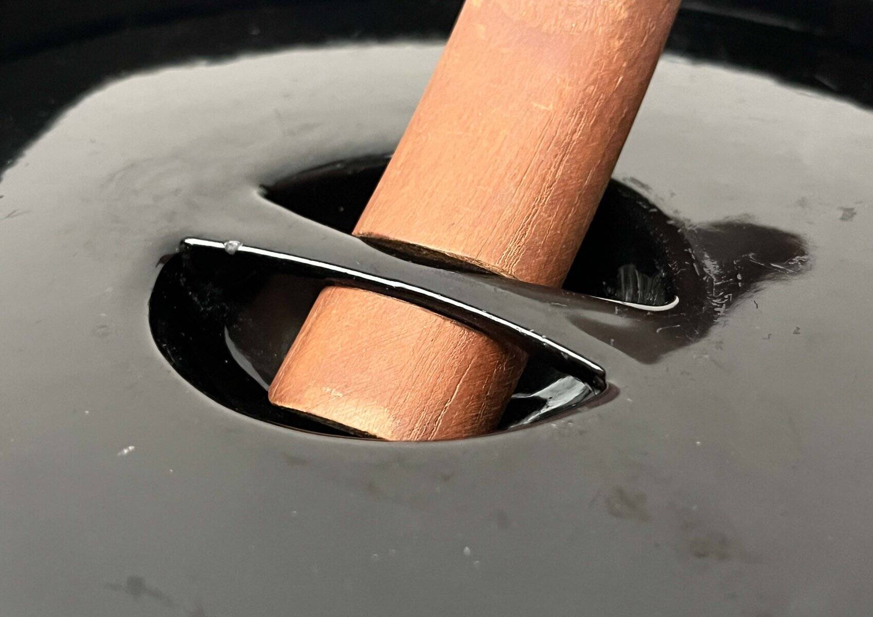 Black enamelled cast iron pot with a teak handle in mid-century style by Timo Sarpaneva for Rosenlew of Finland, 1960s.