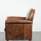 Beautiful vintage sheep leather armchair with a characterful appearance