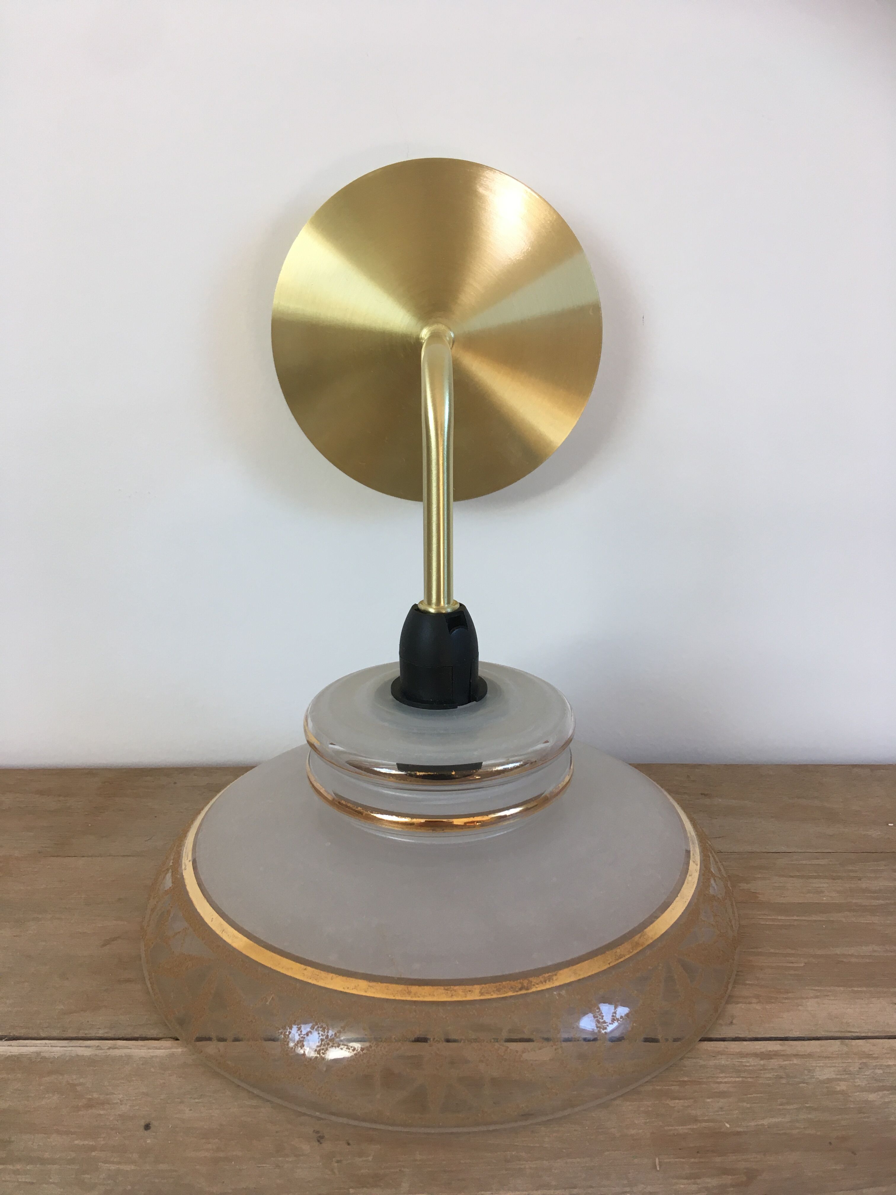 Vintage globe wall lamp in glass and brass base