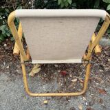 Rattan armchair and foldable canvas