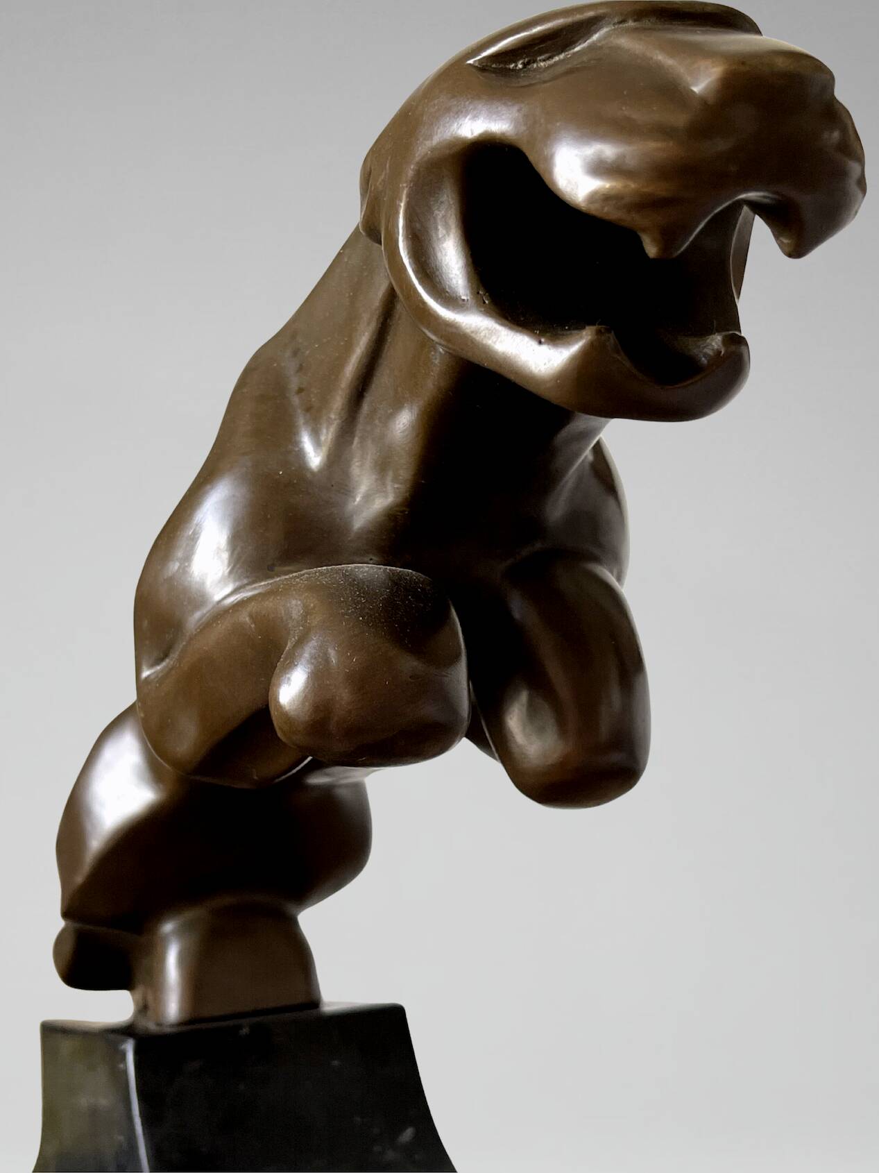 Large Art Deco bronze patinated Jaguar sculpture on an architectural base.