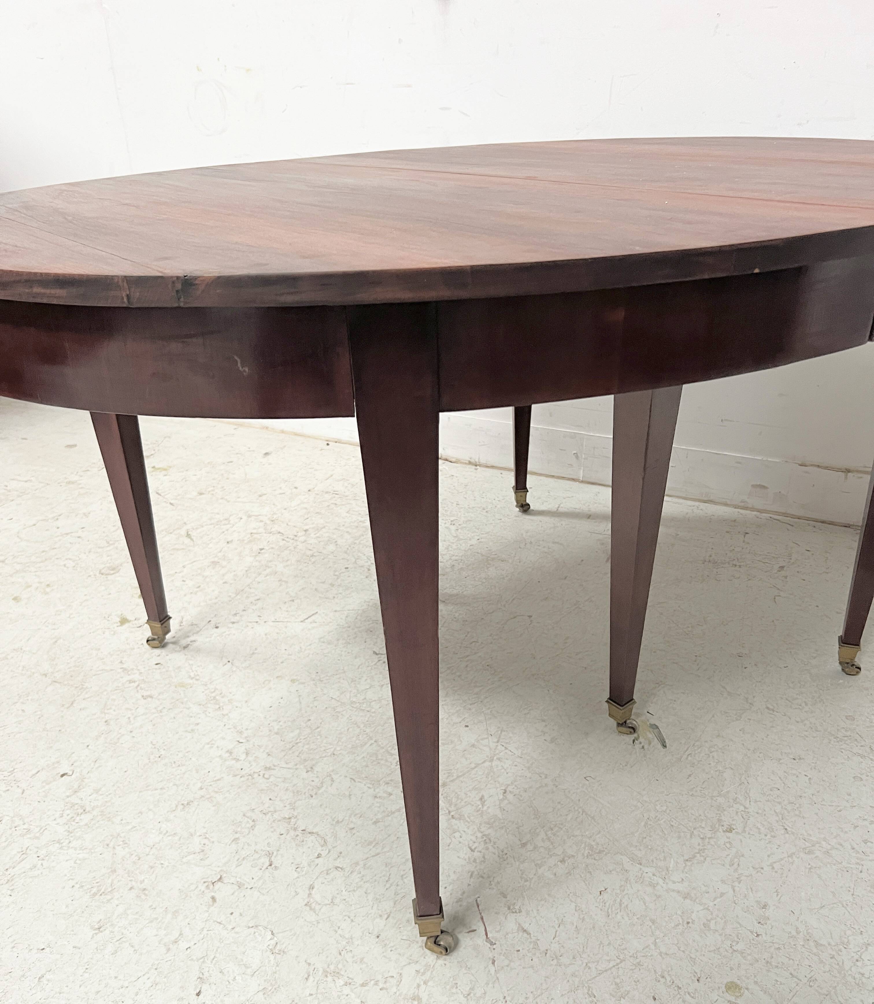 Louis XVI style bandeau table with 6 XIX century tapered legs.