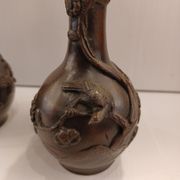 Pair of bronze soliflore vases. Japan, 19th century.