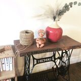 Cast iron and solid wood side table