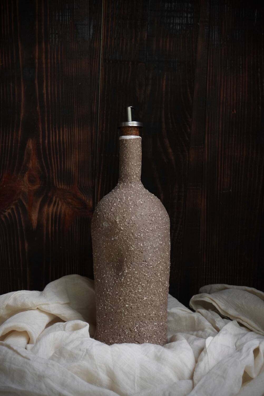 Ergonomic stoneware oil bottle