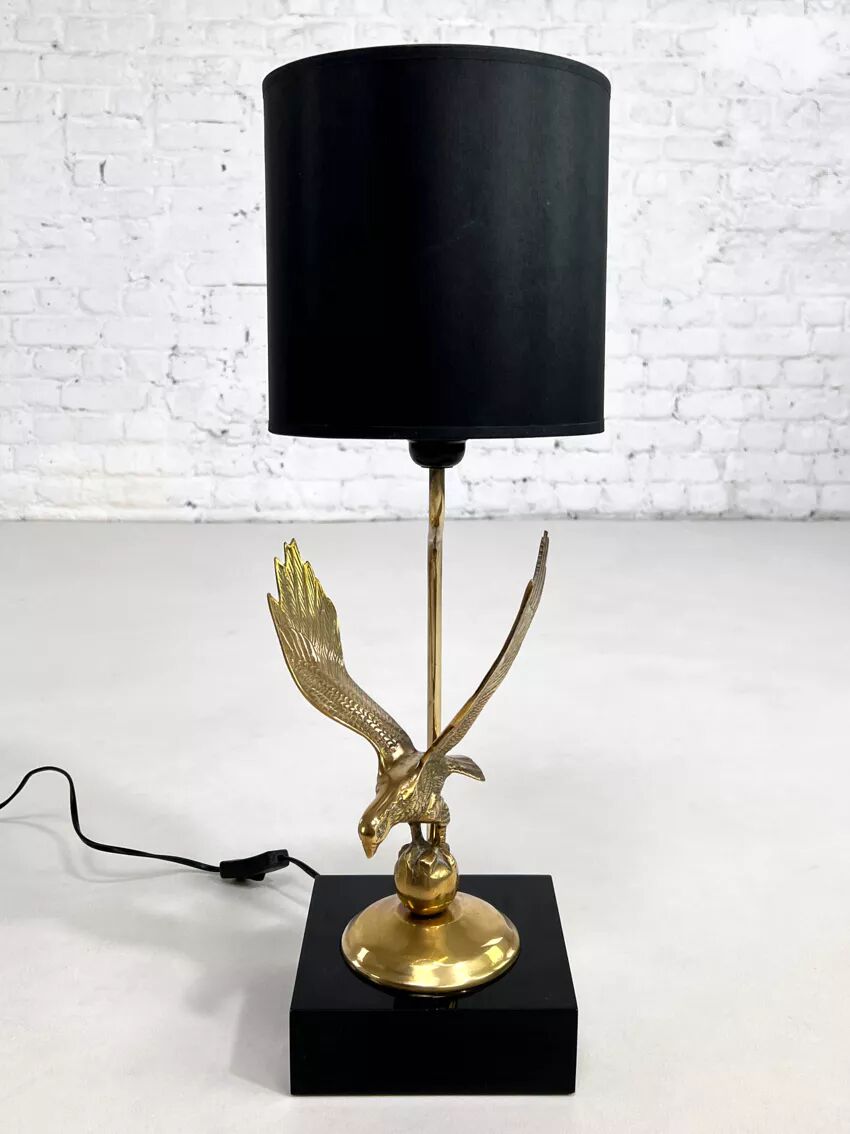 Brass lamp on black lacquered wooden base