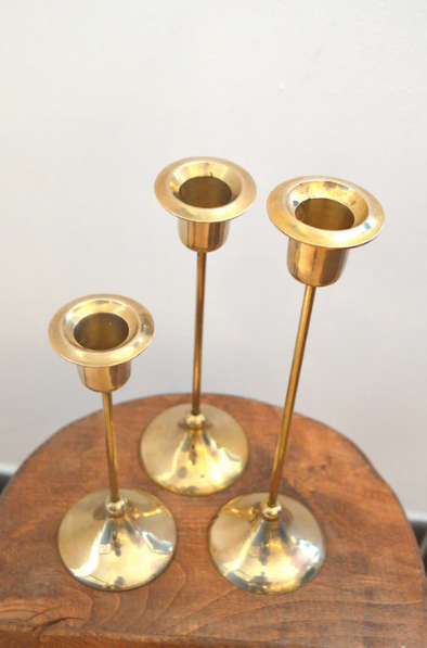 Trio of brass candlesticks