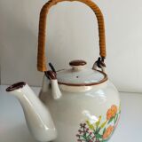 Flowered stoneware teapot with vintage rattan handle