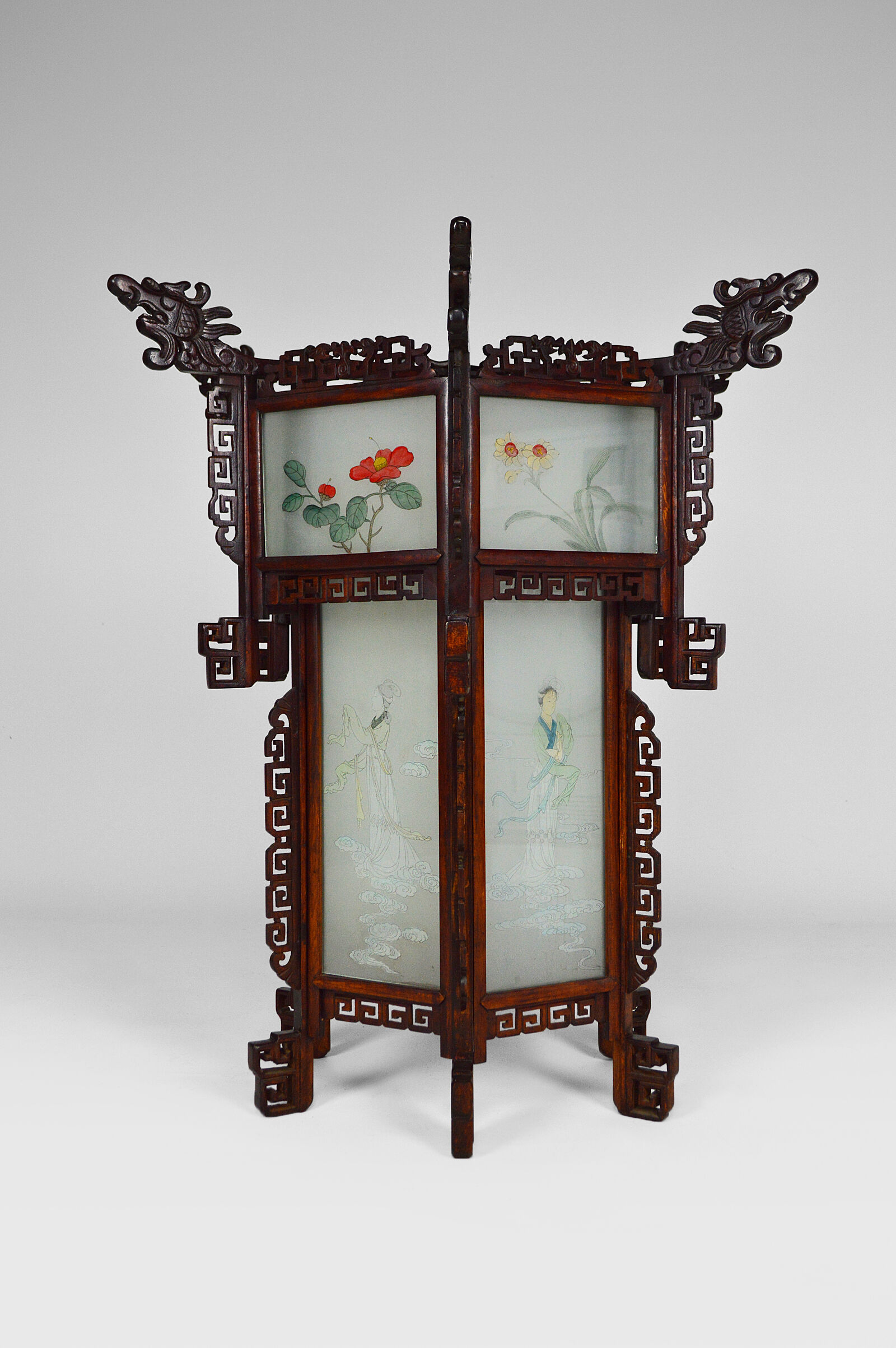 Asian wooden lantern carved with dragons and painted glass panels