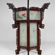 Asian wooden lantern carved with dragons and painted glass panels