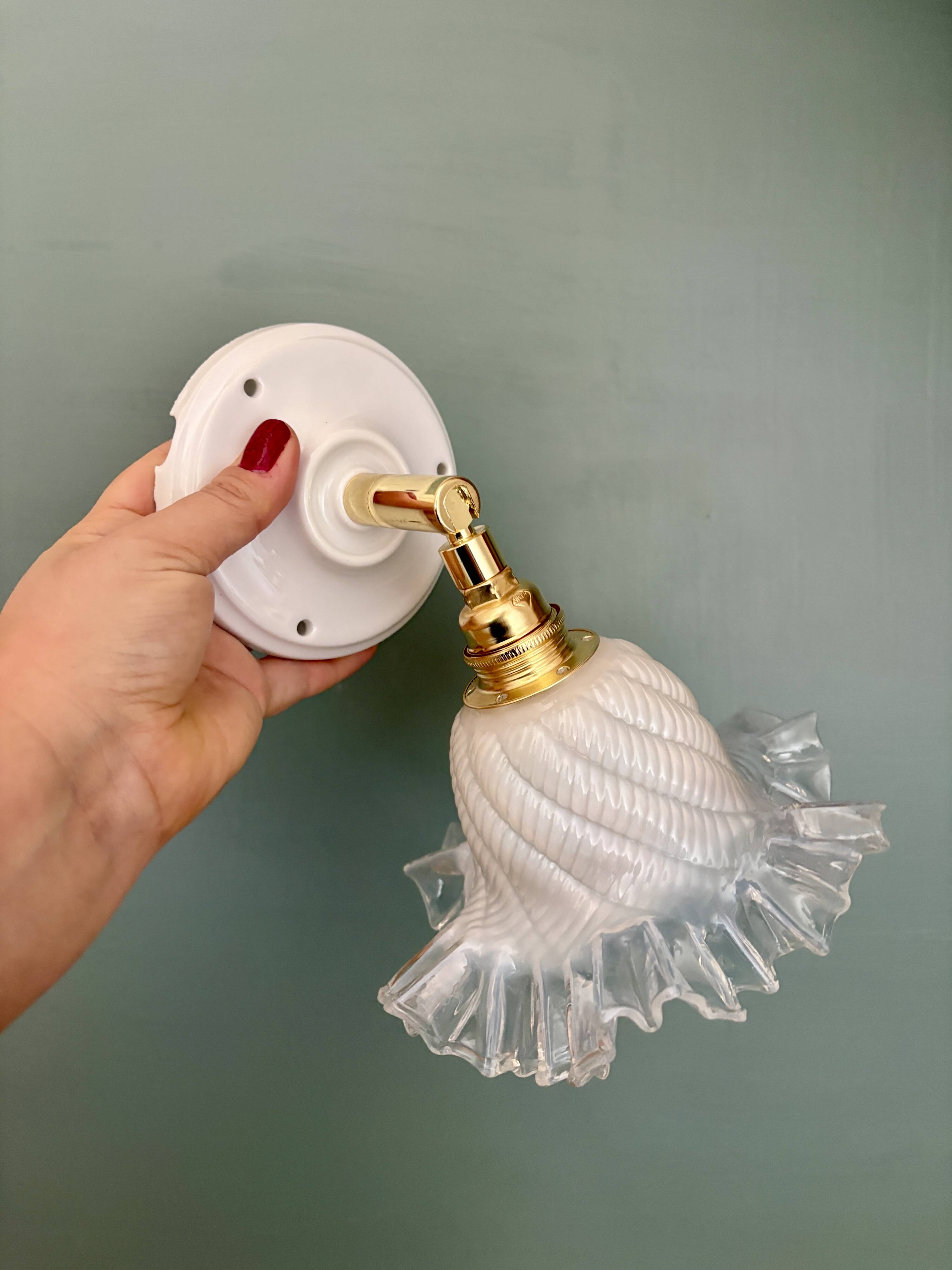 Vintage tulip glass wall light in transparent, slightly pearlescent white.