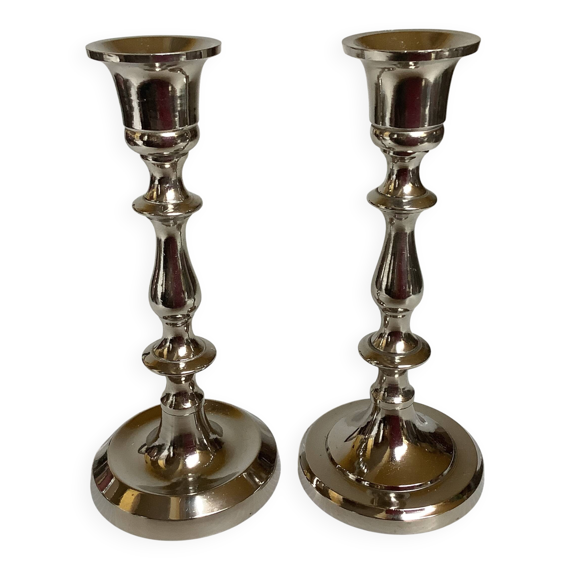 Pair of silver metal candlesticks