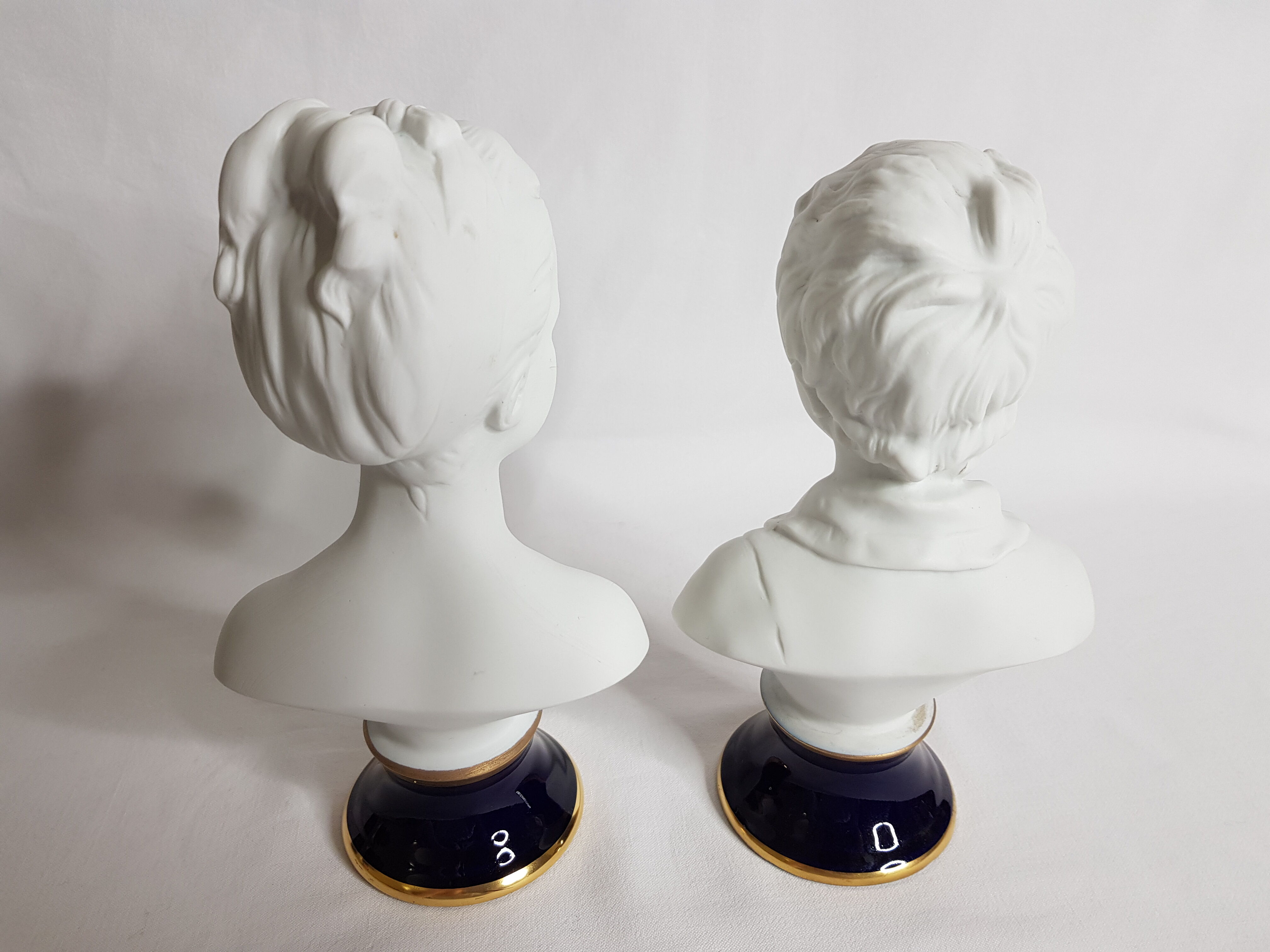 Porcelain biscuit busts by Camille Tharaud, children Louise and Alexandre Brongniart after Houdon