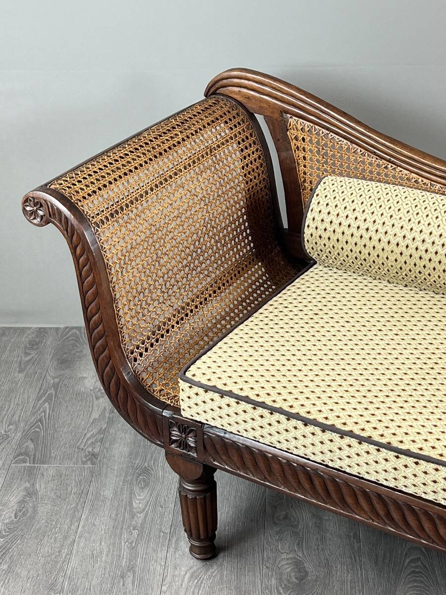 Louis XVI style meridian in carved wood and caning, 19th century.