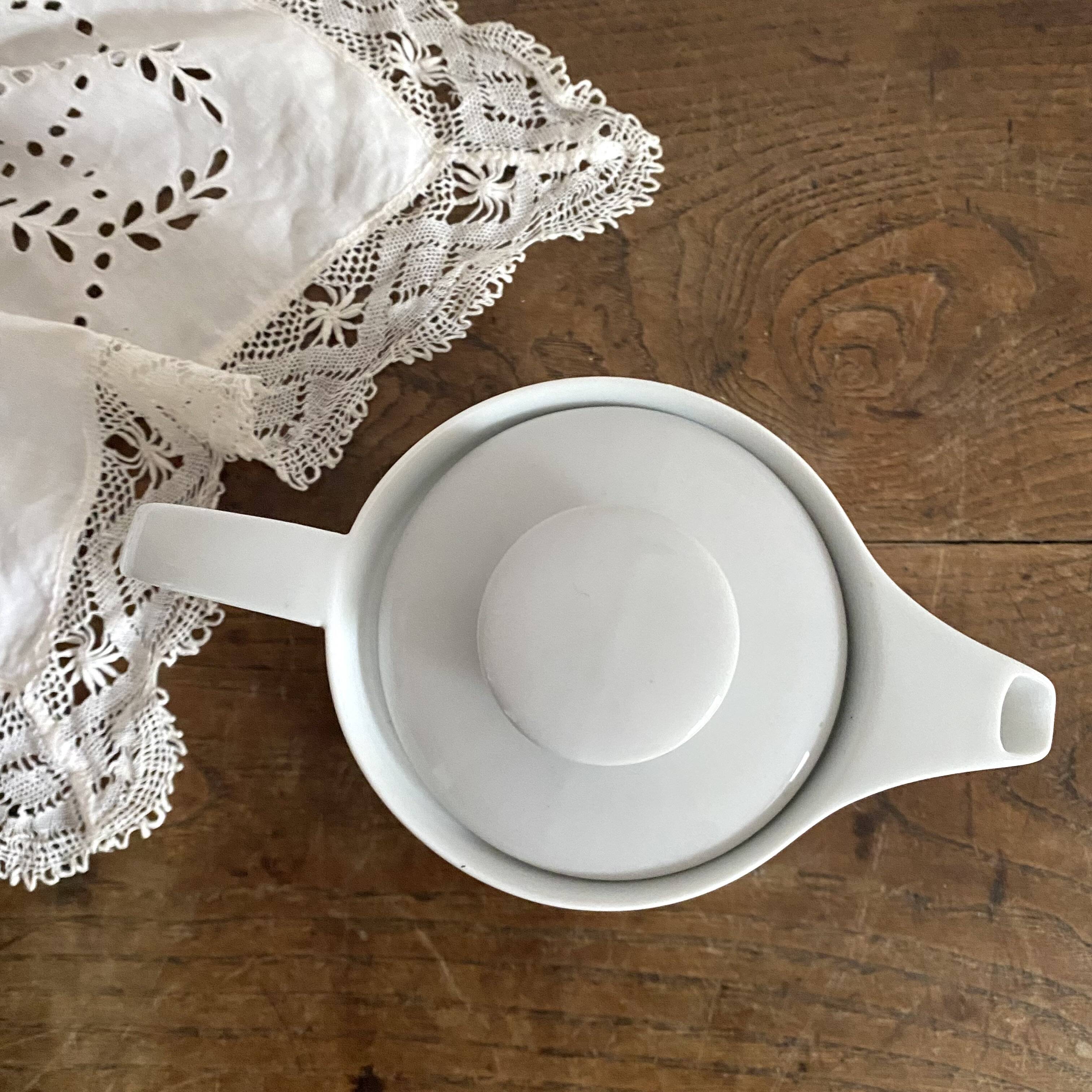 Porcelain teapot with hand-painted bird decoration