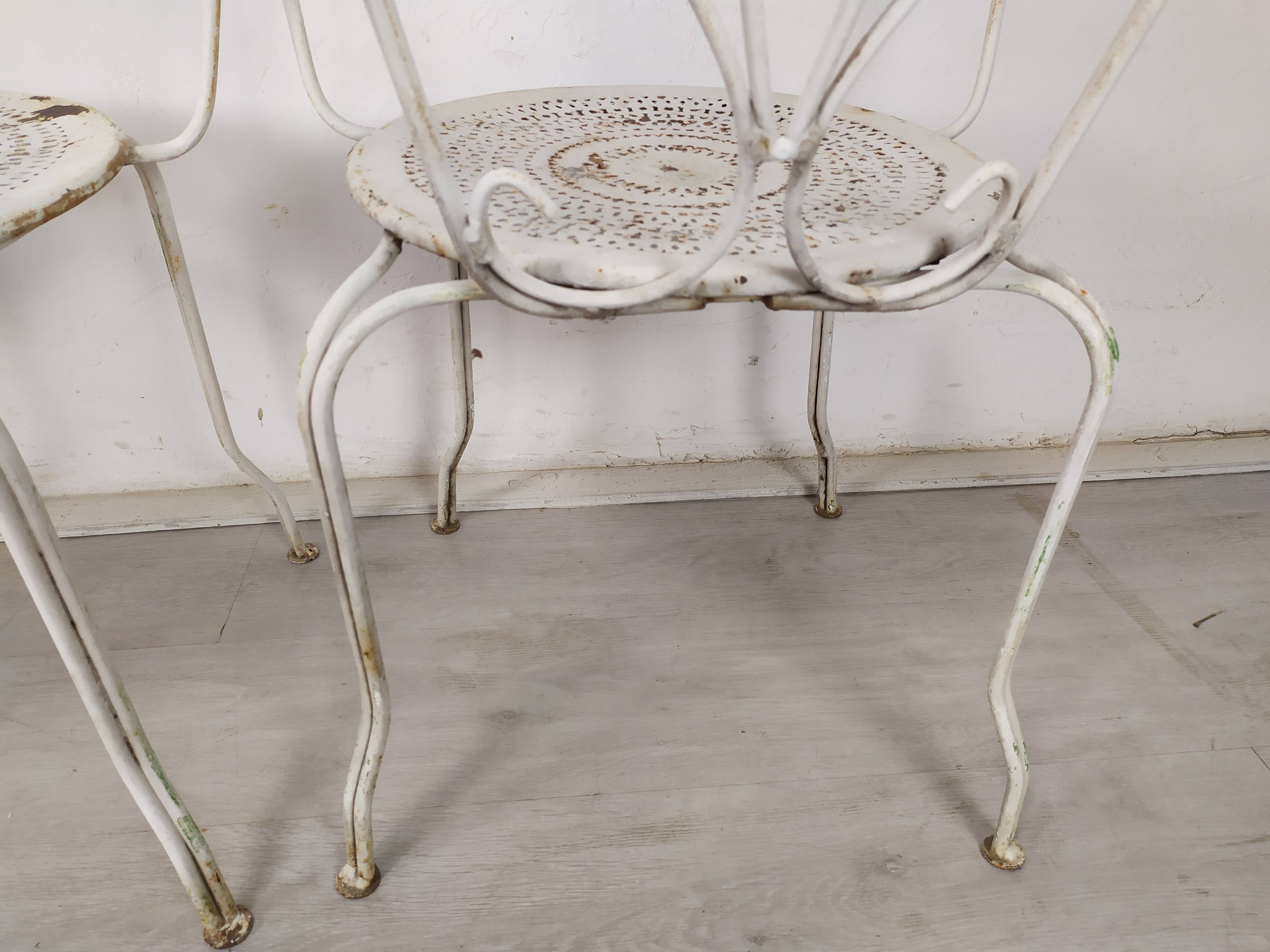 4 wrought iron garden armchairs