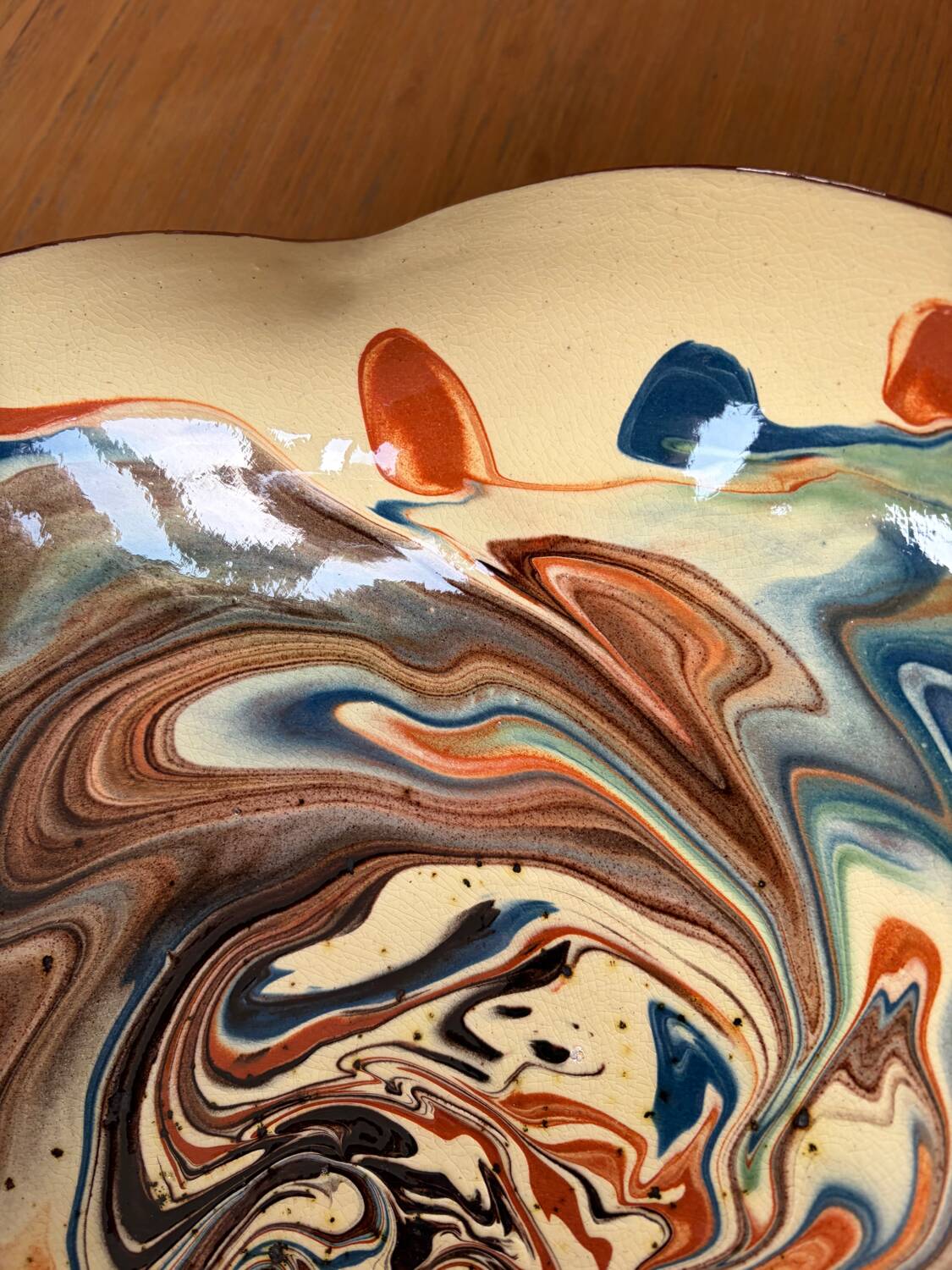 Glazed ceramic plate signed