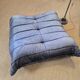 Togo sofa by Ligne Roset and its pouf from the 1970s.