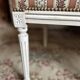 Pair of Louis XVI style chairs in painted wood and satin, classic elegance.
