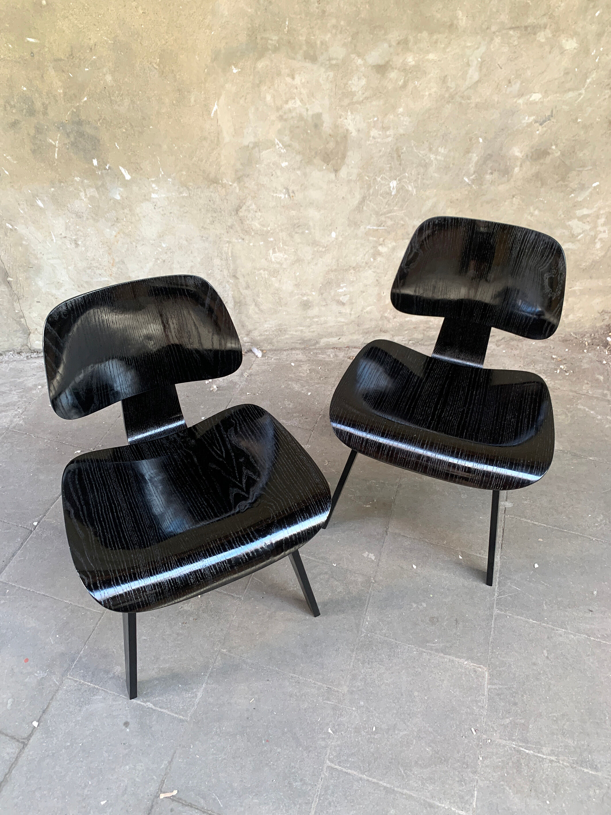 Pair of DCW chairs by Charles & Ray Eames in Black for Herman Miller 1950