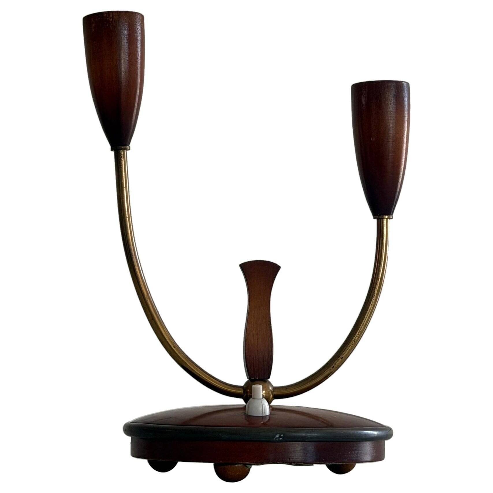 Simple double-headed table lamp in wood and brass, 1960s, Germany.