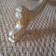 Golden parrot coat rack