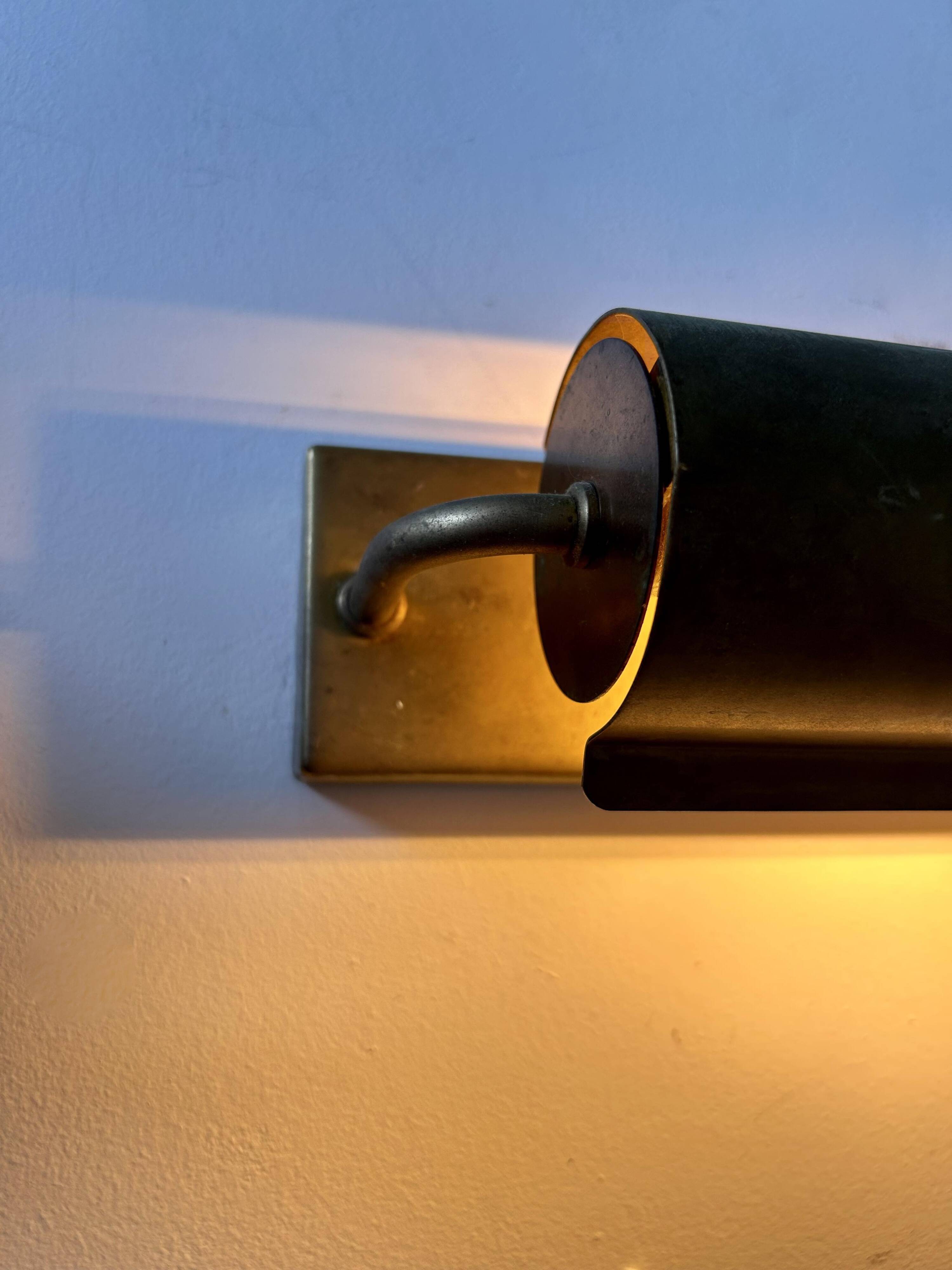Modernist solid brass wall light, France 1940