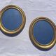Duo de miroirs ovales et dorés en bois
