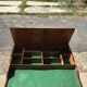 Bracelet holder and antique brown and green fabric watch, vintage 1920s furniture.