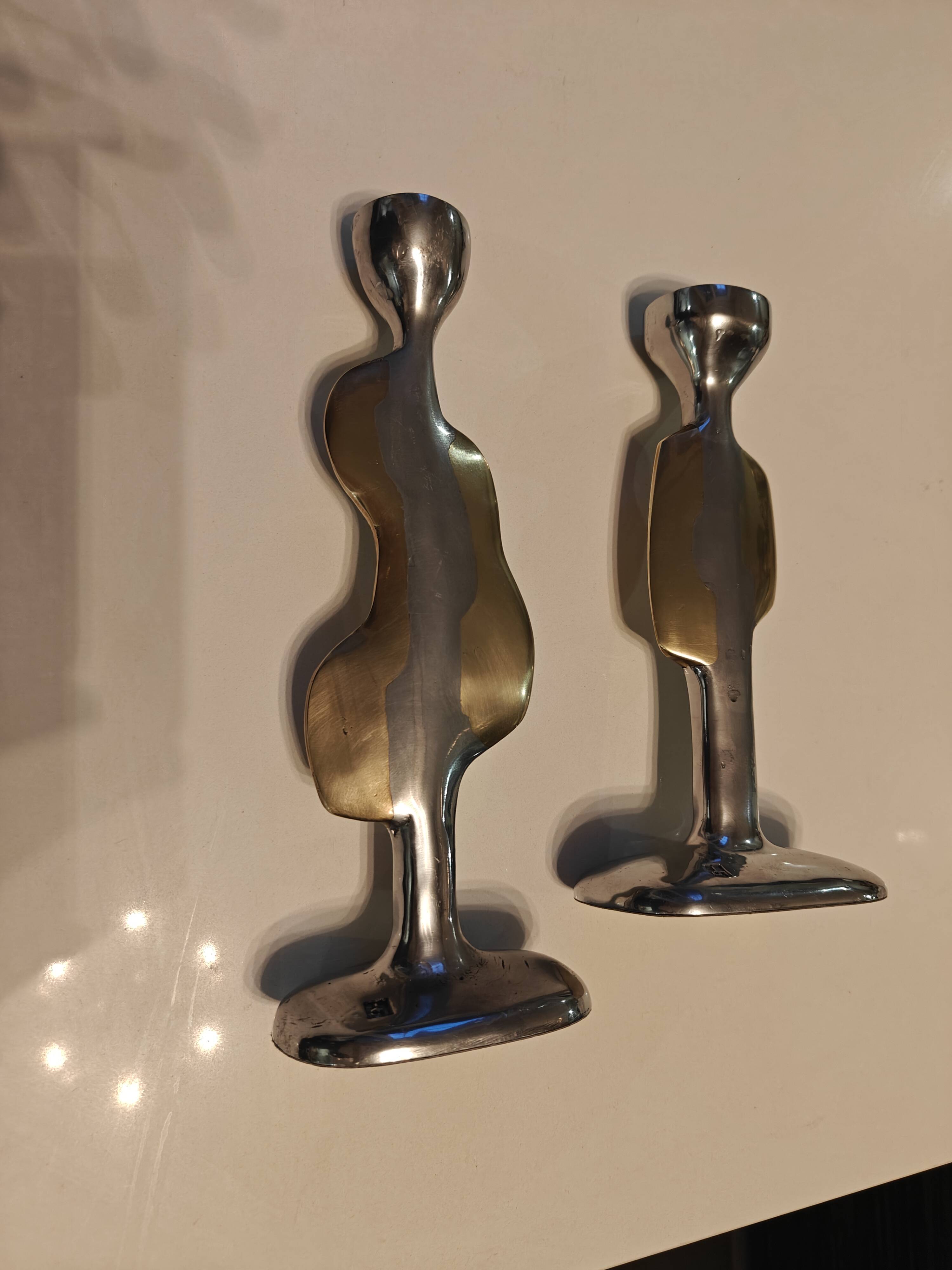Pair of large candlesticks by David Marshall