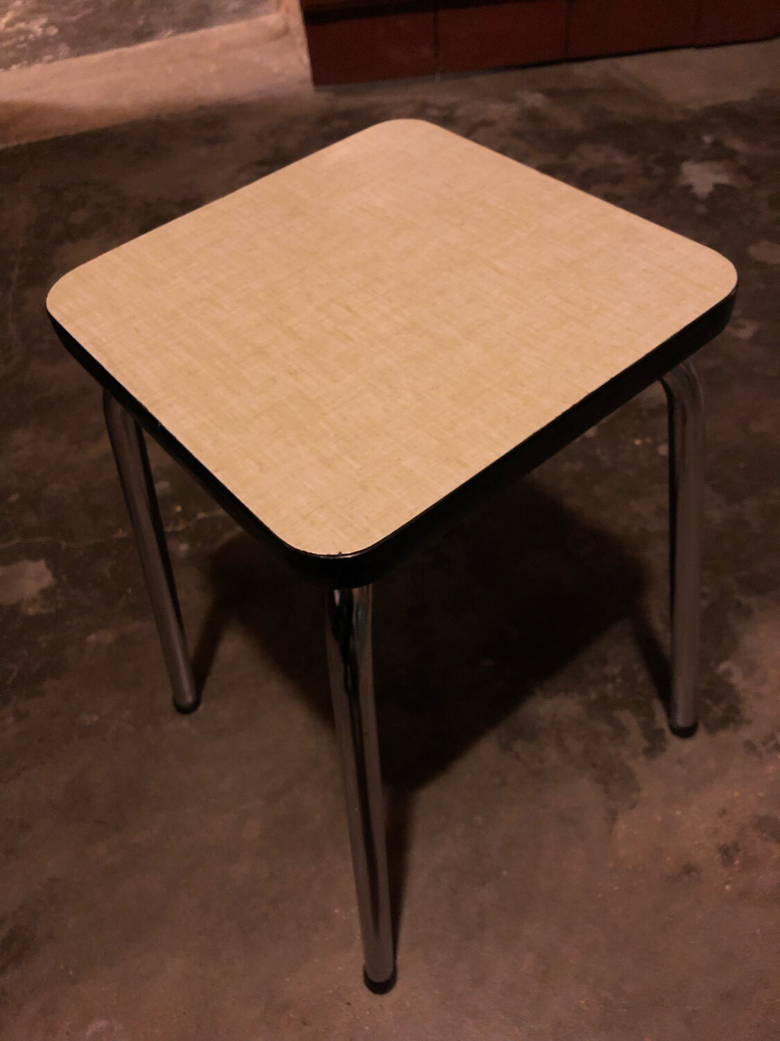 Pale yellow formica stool
