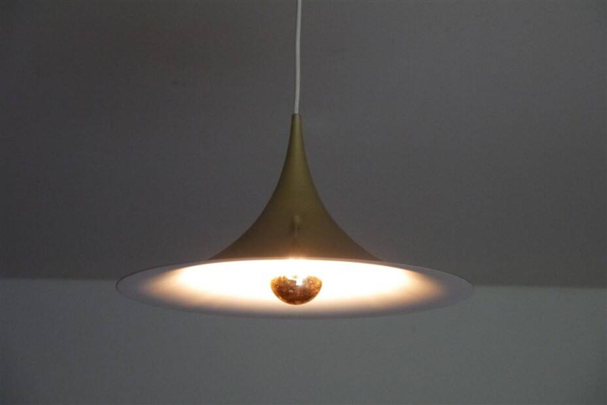 Semi pendulum pendant lamp by Thorup and Bonderup in brass