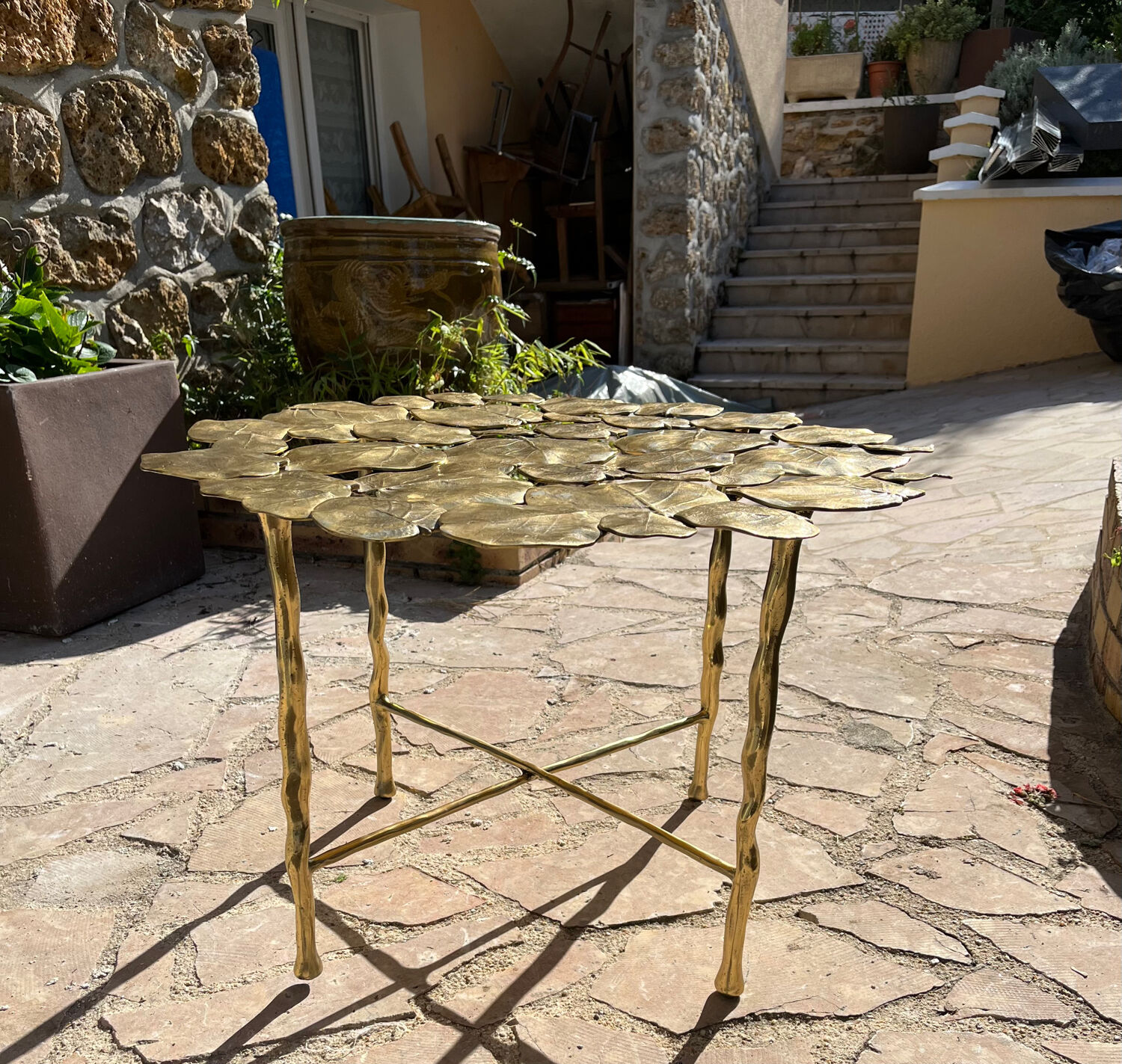 Carved brass coffee table with ginkgo decor