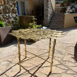 Carved brass coffee table with ginkgo decor