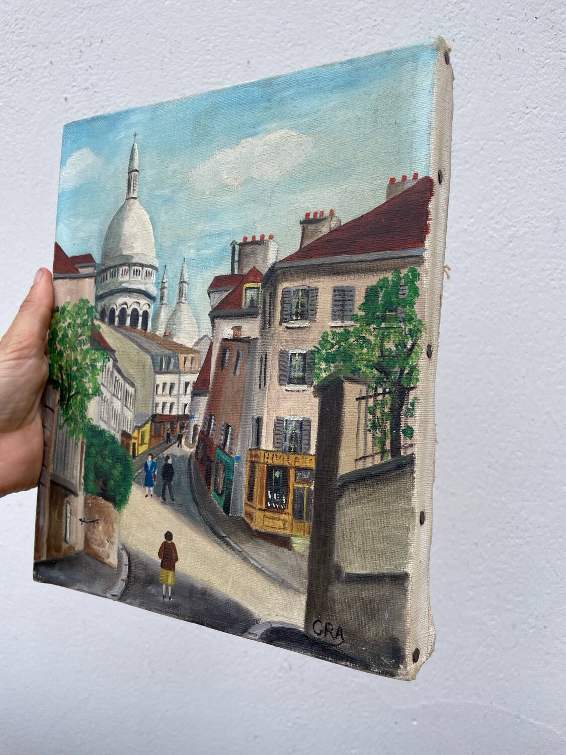 Old oil painting depicting a street in Montmartre