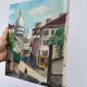 Old oil painting depicting a street in Montmartre