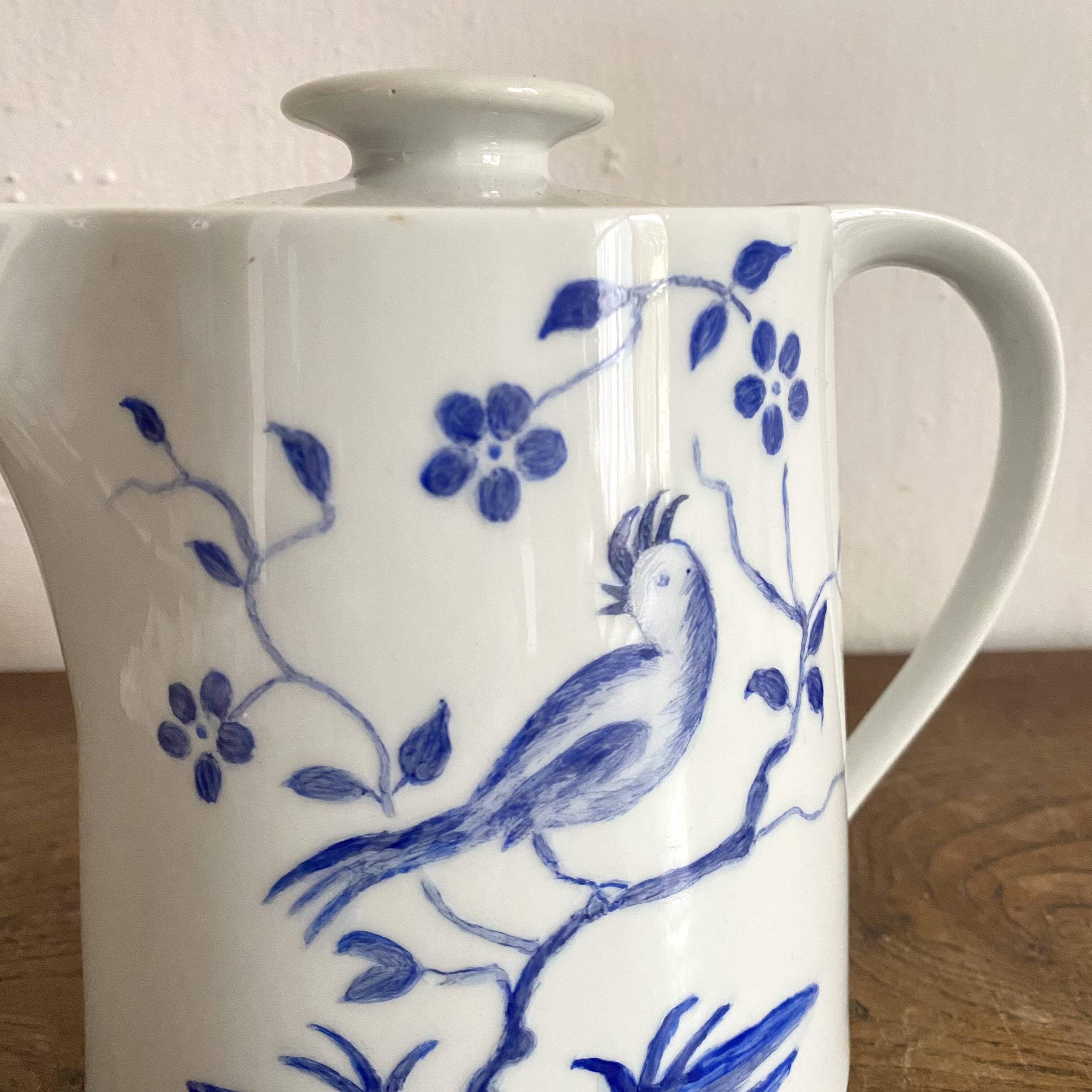 Porcelain teapot with hand-painted bird decoration