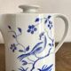 Porcelain teapot with hand-painted bird decoration