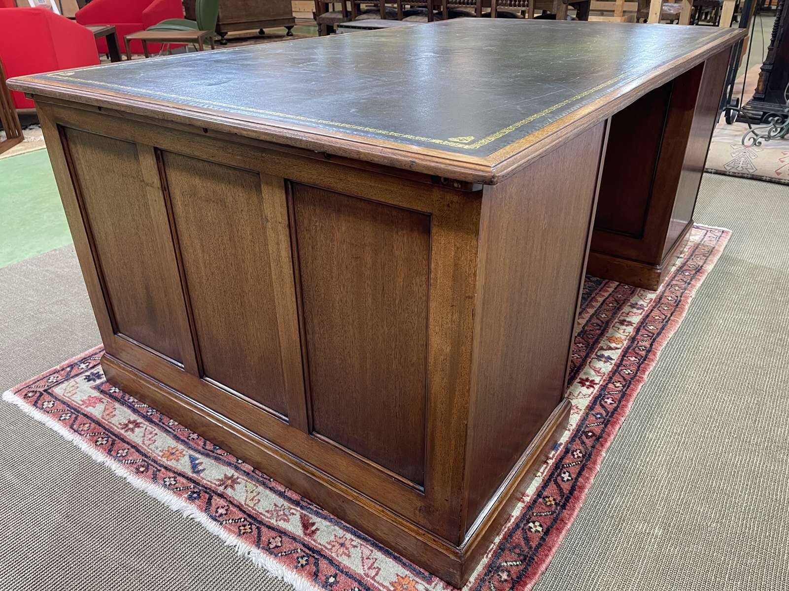 Large English flat desk in mahogany with leather top, early 20th century