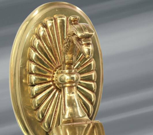 Pair of gilt bronze wall sconces in the Directoire style by Lucien Gau.