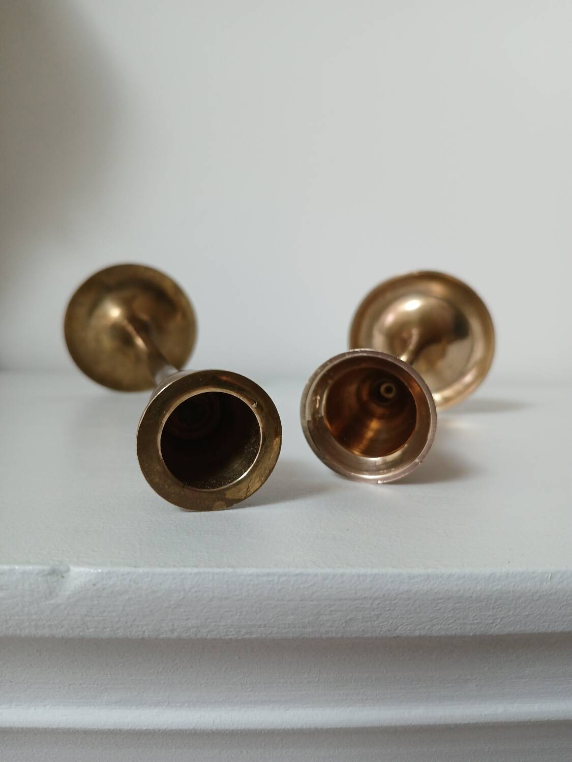 Set of two straight brass candlesticks.
