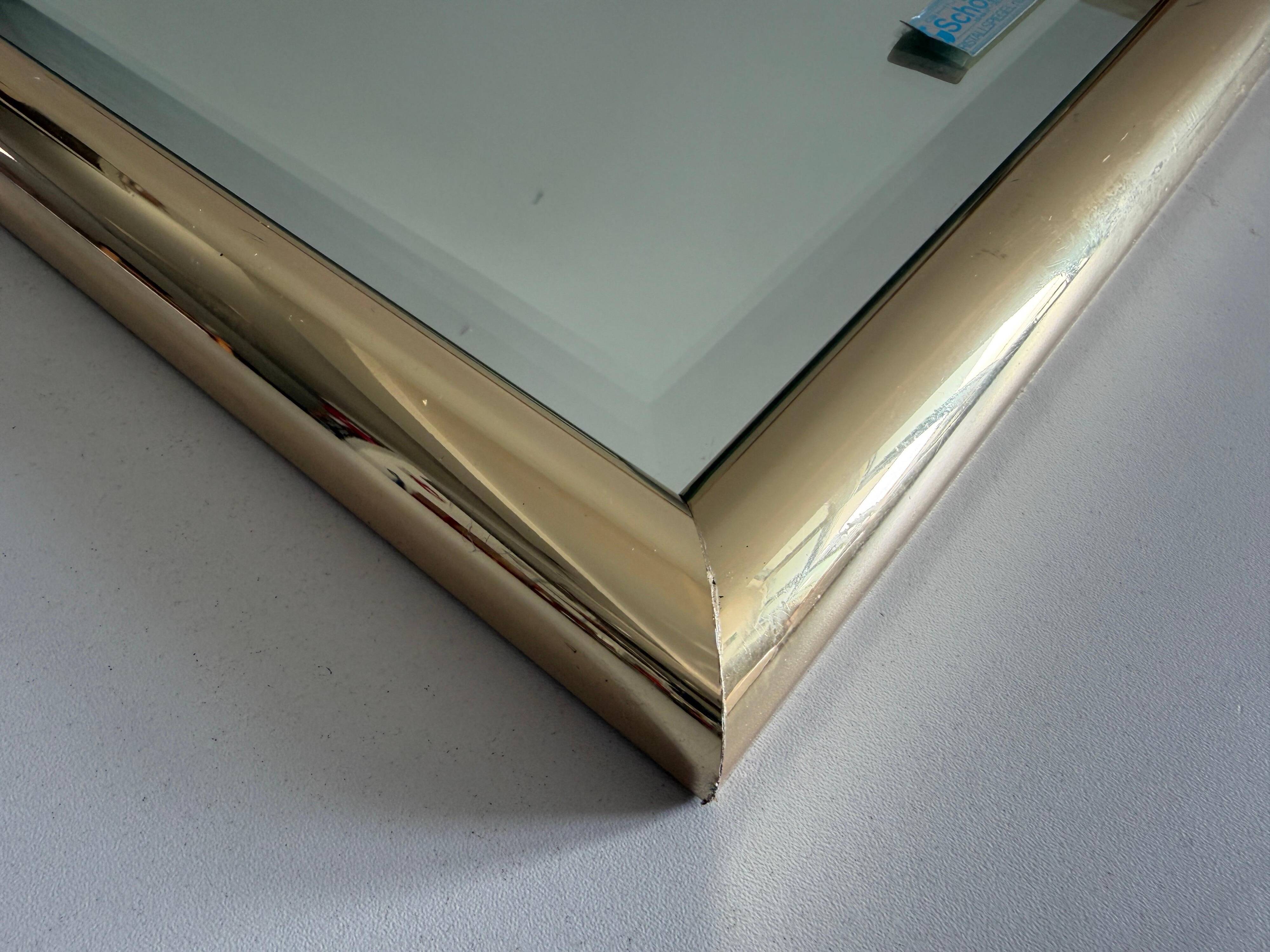 Rectangular wall mirror with a gold metal frame by Schöninger, 1970s, Germany.