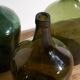 Antique green demijohns (circa 1920). Set of 3 pieces