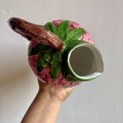 Ceramic jug in the shape of a strawberry.