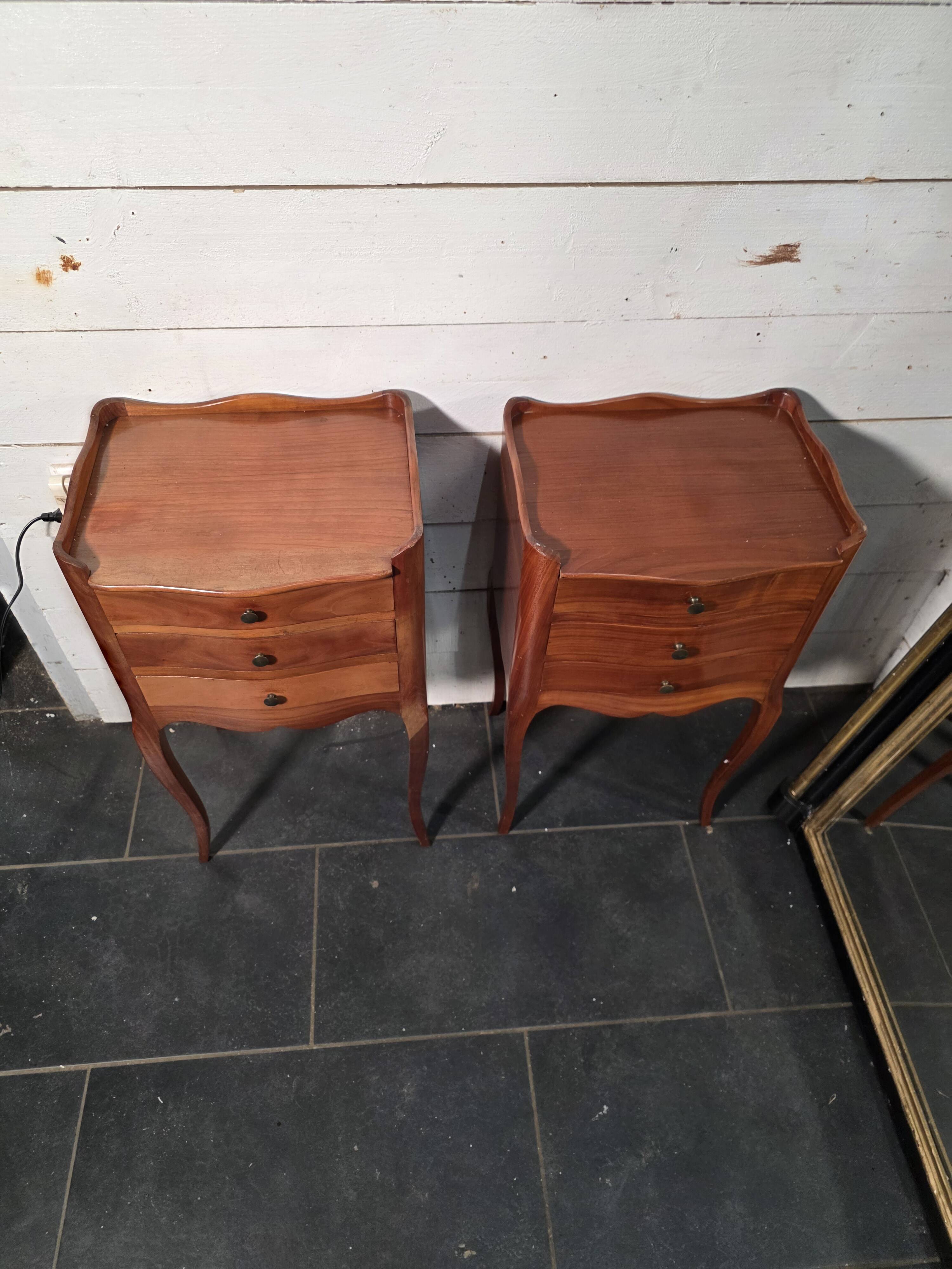 Pair of Louis XV style bedside tables in cherry wood.