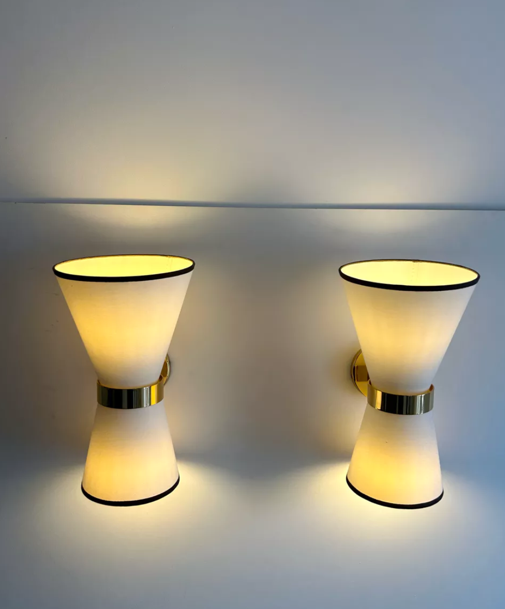 Pair of vintage wall lamps, solid brass and unbleached fabric, Italy 1980
