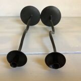Pair of black hysteria-style candlesticks